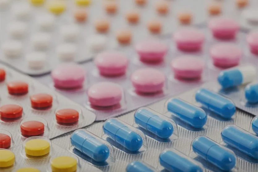 Why do generic drugs cost less and have a different appearance than brand-name drugs?
